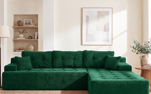 Green corduroy modular sectional sofa in a styled living room