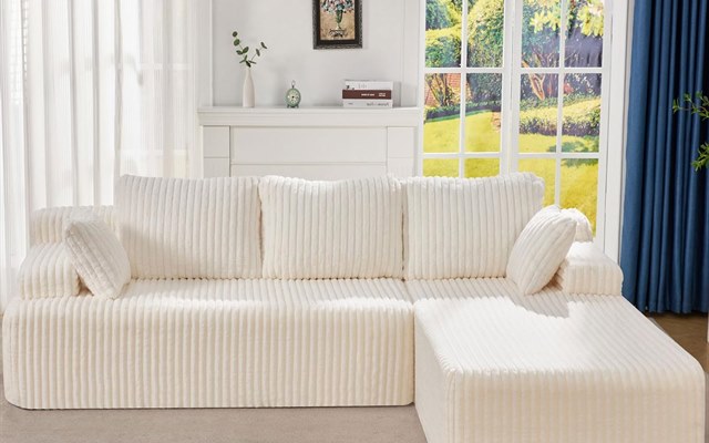 Ivory corduroy sectional sofa in a bright living room